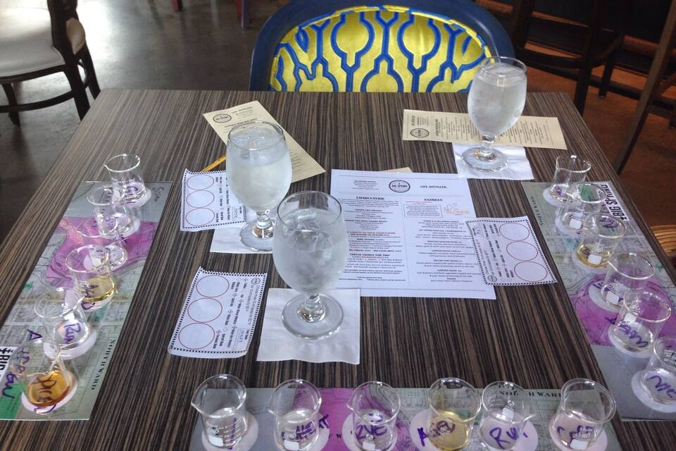 A table with wine tasting glasses and menus.