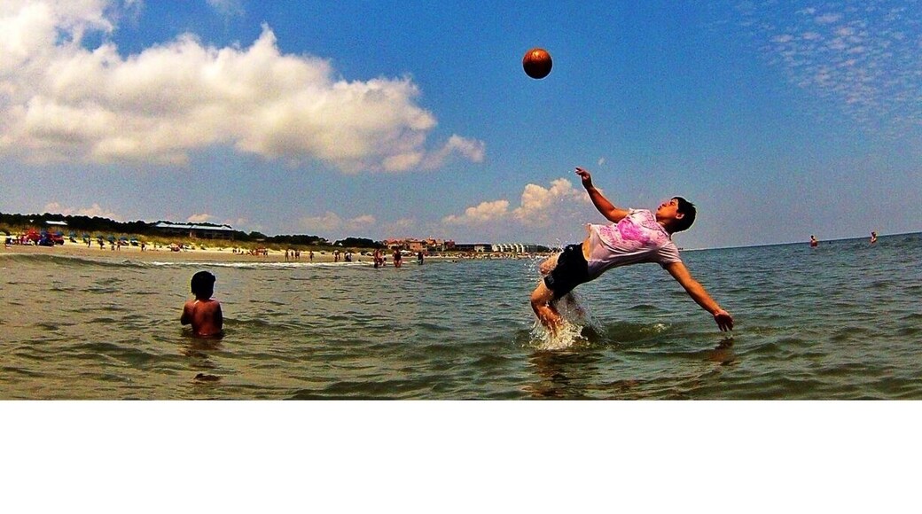 Welcome to Burkes Beach... Hilton Head Island is known for its bike riding so this beach is easily accessible from the many bike baths along the way. The waves here are decent on a windy day the could get up to 8 foot waves at high tide. There's a sandbar that goes out at least 1/4 mile from the shore its crazy to be standing that far out. Do not get off the sand bar or you will attract the lifeguard. There is also a lagoon, it's perfect to get out of the waves and a great inlet for fishing. As for the picture this is Juan Casanova from Ecuador. He currently lives in North Carolina with his family playing soccer on the weekends. On this particular day he was showing us his bicyclekick it was quite a show. I would highly recommend a vacation to Hilton Head.
#soccer #beach