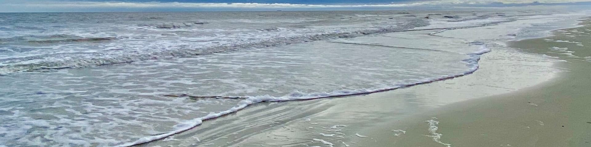 Clouds, surf and sand at Coligny Beach. 😎