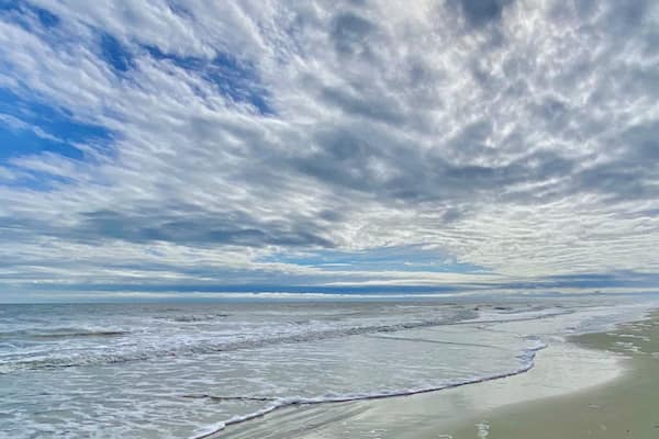 Clouds, surf and sand at Coligny Beach. đ