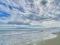 Clouds, surf and sand at Coligny Beach. 😎