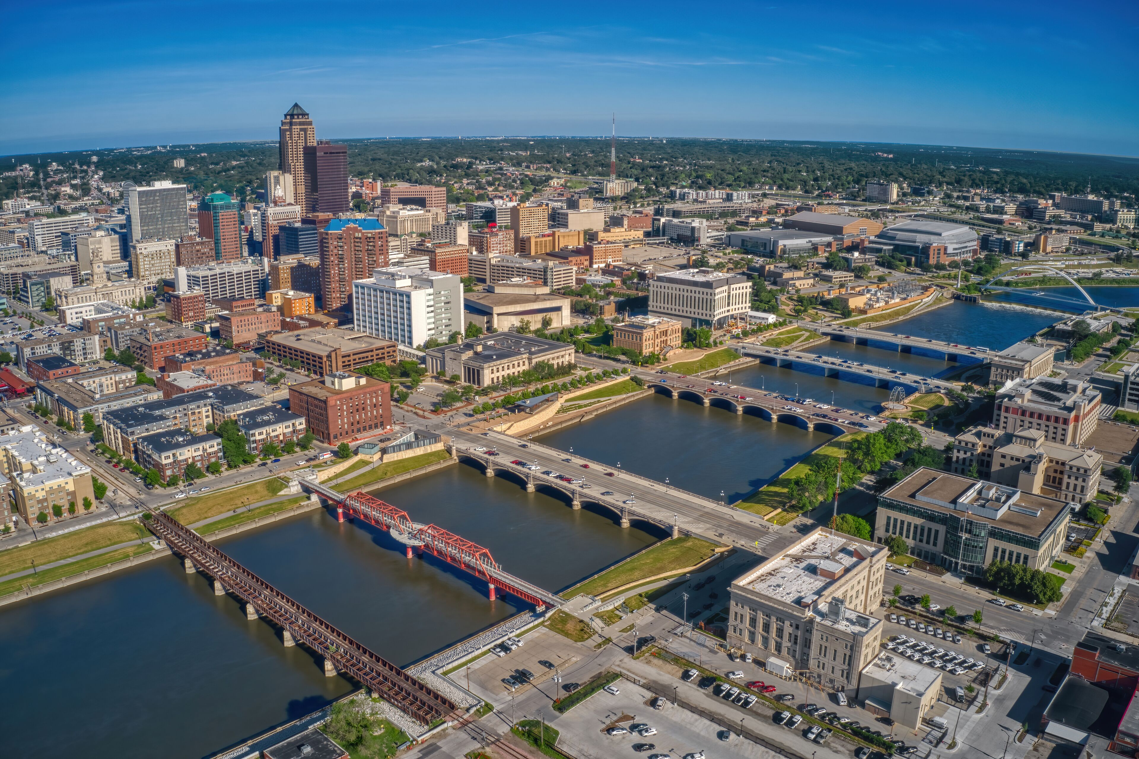 A cityscape with a river, bridges, and various buildings.