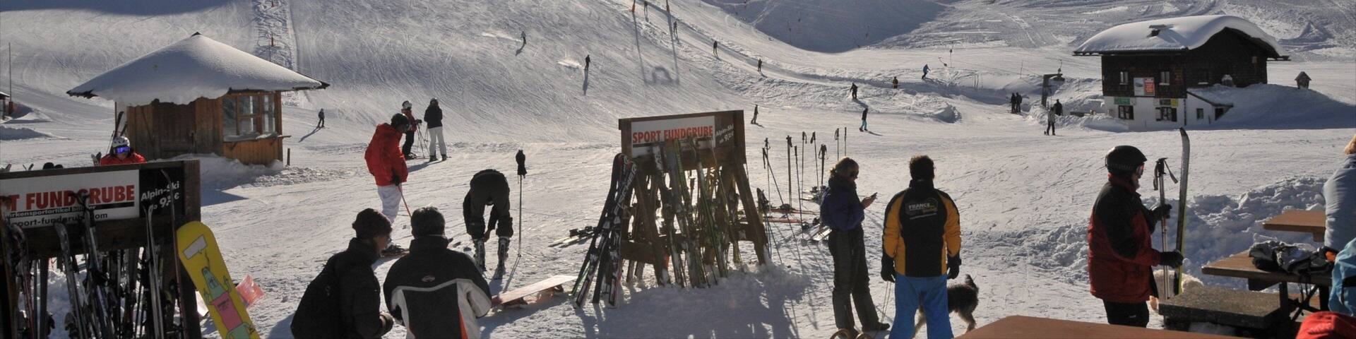 Spitzingsee featuring snow skiing and snow as well as a small group of people