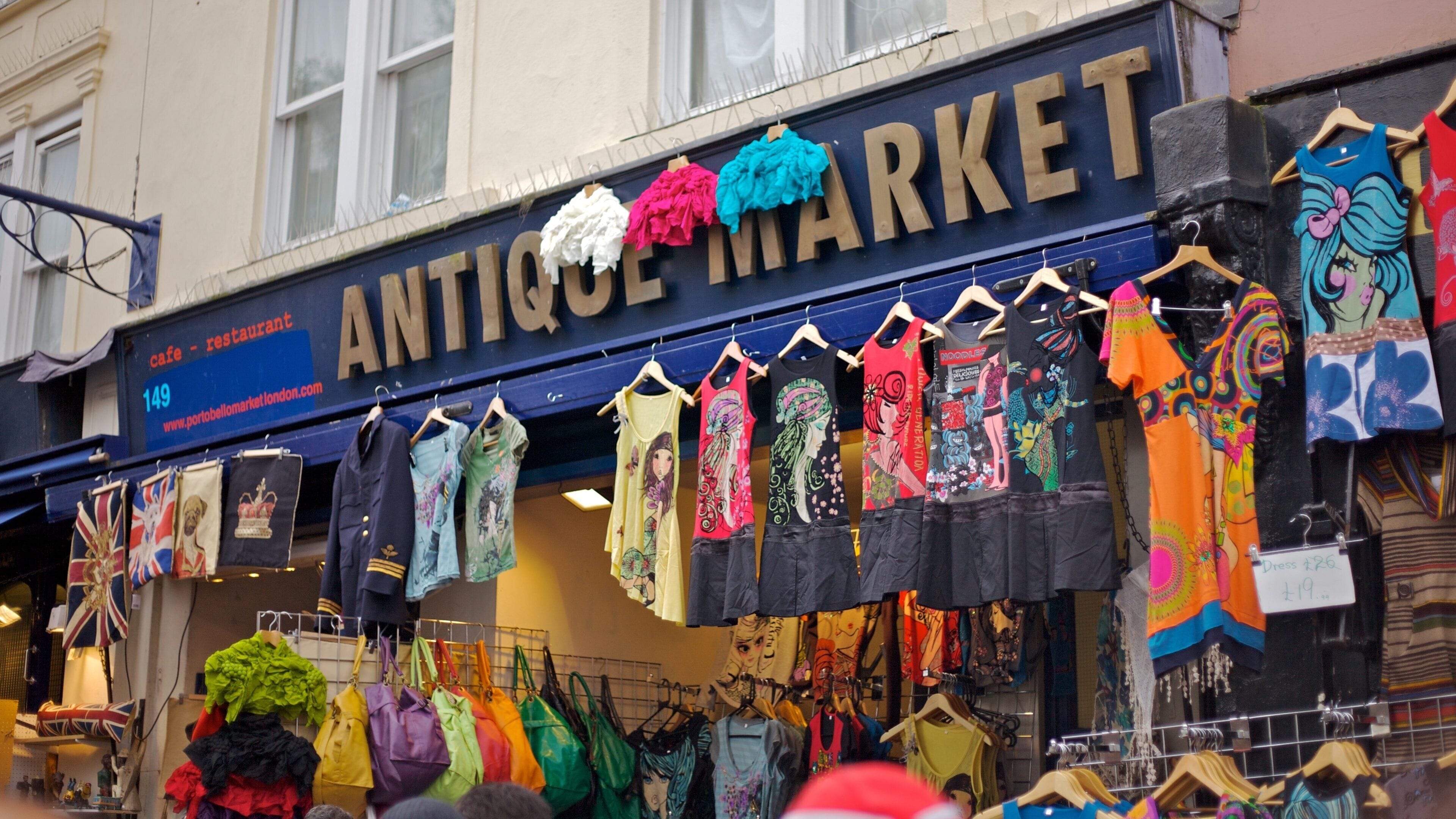 Notting Hill featuring shopping, signage and markets