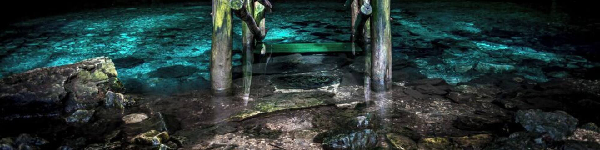 Enter the darkness of the Dzom-Bacal cenote, near the town of Cacao.