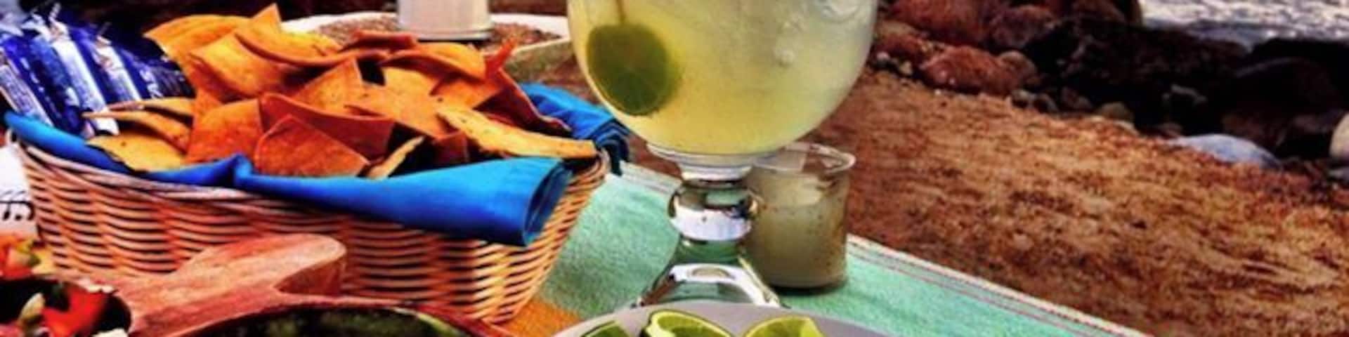 Dinner at the best table in the house !
A great place for lunch and drinking... obviously the specialize in Margaritas and have many different and unique variations and will even create one for you if you have a special request. The food was average and I would choose to eat next door at Rosas. The location is awesome, our table was a few feet from the crashing surf.
The one major turn off was the endless procession of street vendors parading their wares past us. My colleague made the mistake of buying something from one of them and then they all descended on us like flies to #$!@. There are better deals in the shops but if you do buy from them... haggle. You can always get it for half of the initial asking price.
#restaurant