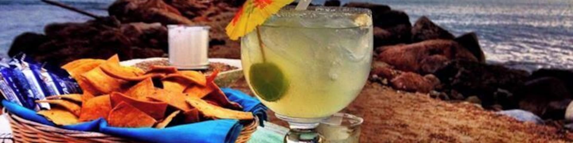 Dinner at the best table in the house !
A great place for lunch and drinking... obviously the specialize in Margaritas and have many different and unique variations and will even create one for you if you have a special request. The food was average and I would choose to eat next door at Rosas. The location is awesome, our table was a few feet from the crashing surf.
The one major turn off was the endless procession of street vendors parading their wares past us. My colleague made the mistake of buying something from one of them and then they all descended on us like flies to #$!@. There are better deals in the shops but if you do buy from them... haggle. You can always get it for half of the initial asking price.
#restaurant