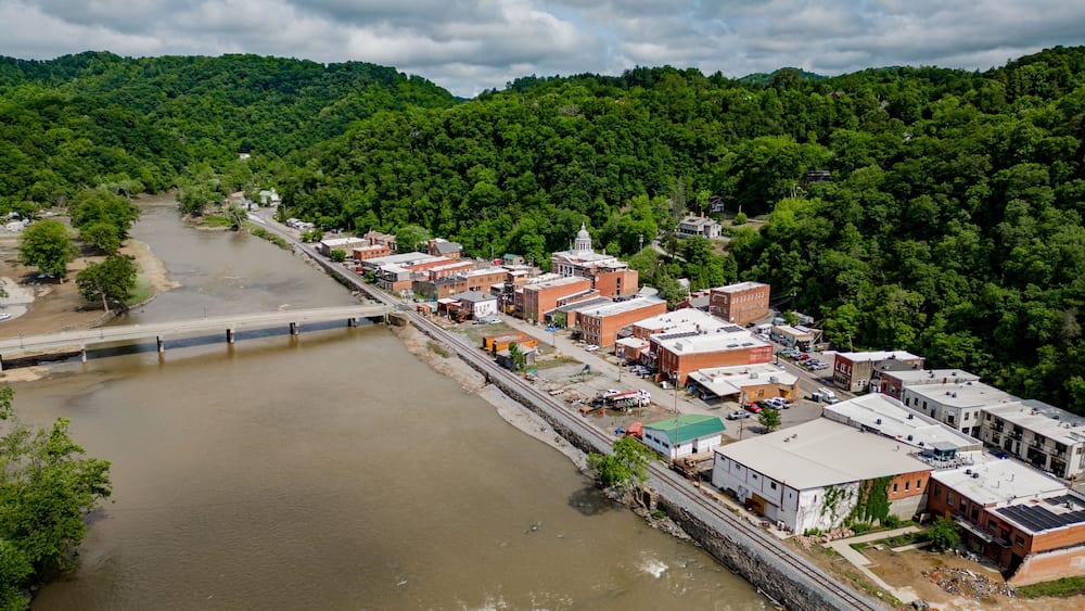aerial view of the river with historic city of marshall north carolina