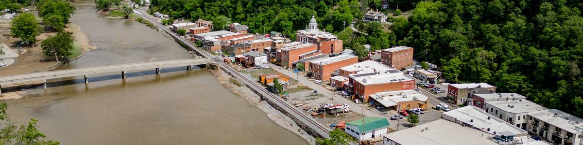 aerial view of the river with historic city of marshall north carolina