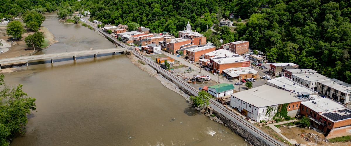 aerial view of the river with historic city of marshall north carolina