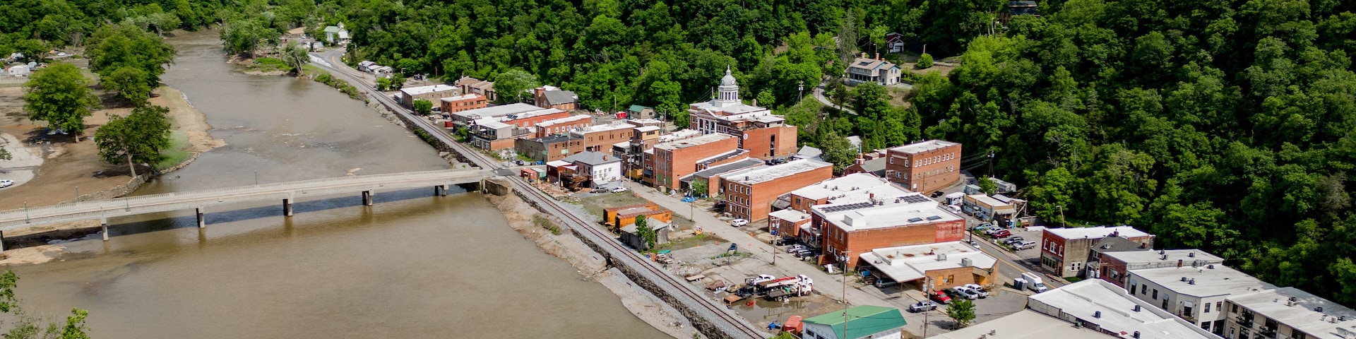 aerial view of the river with historic city of marshall north carolina