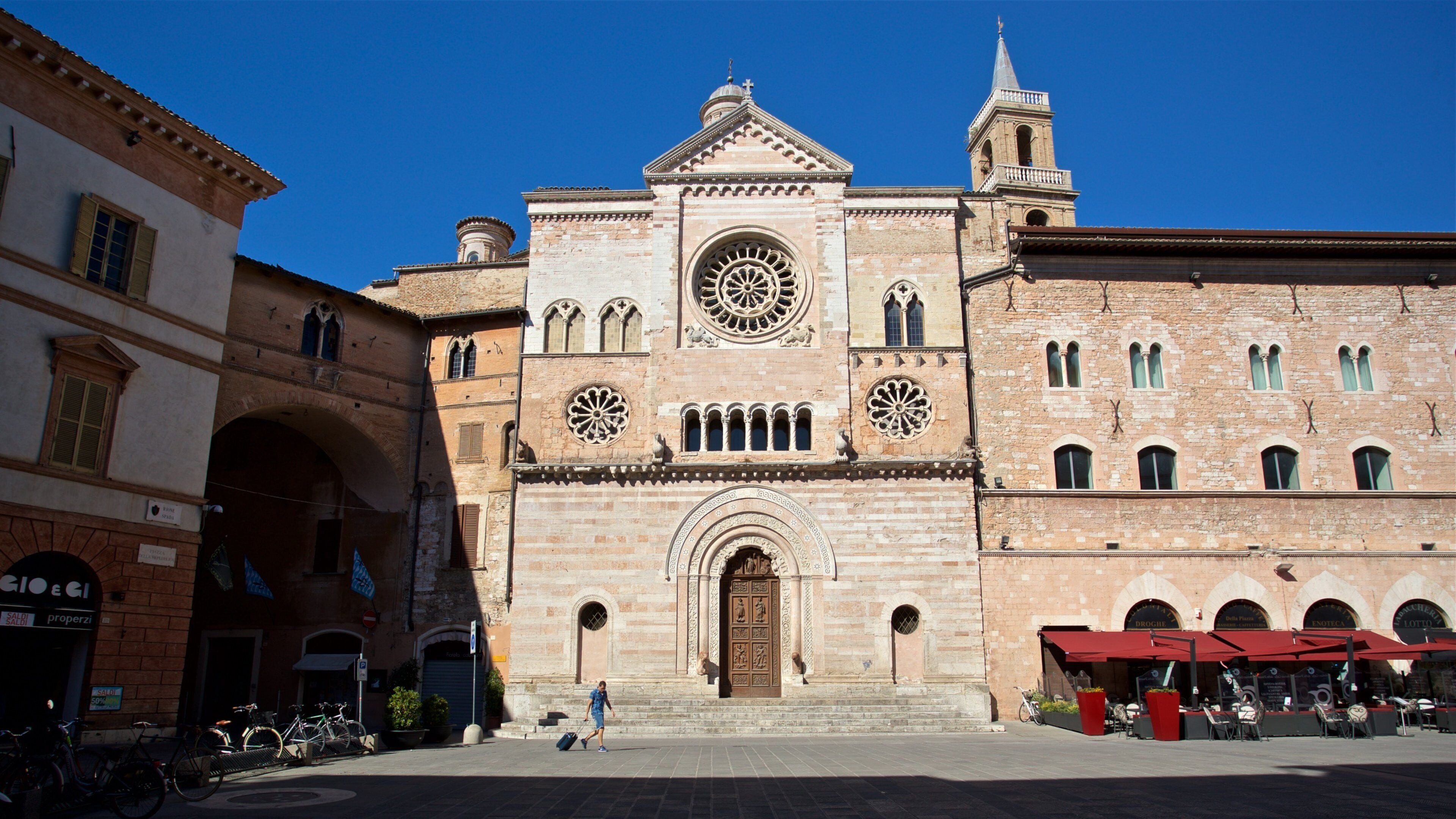 A historic church with a prominent clock tower and arched windows.