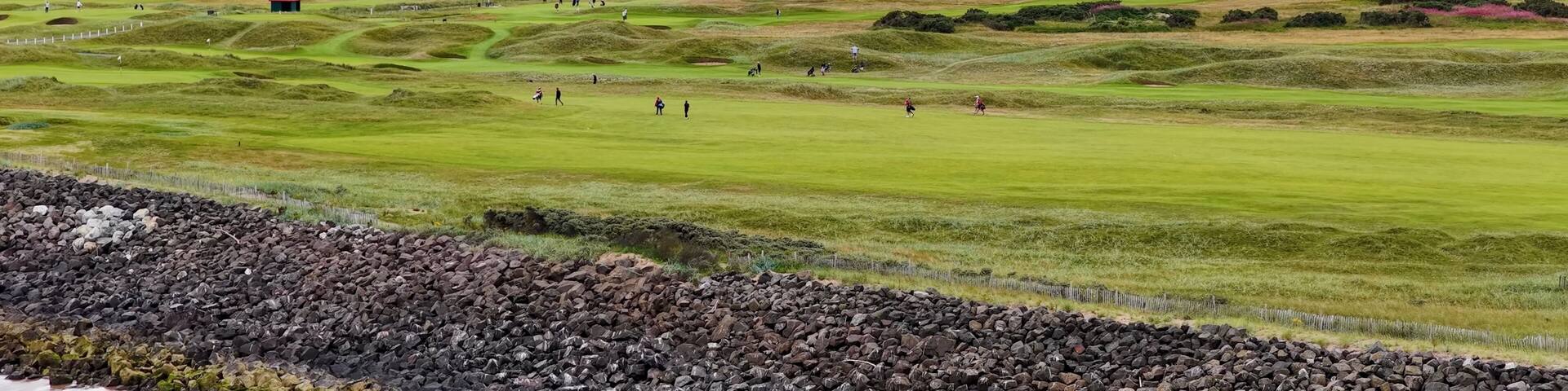 Aerial View of Golfers Walking on Carnoustie Links Under Overcast Sky