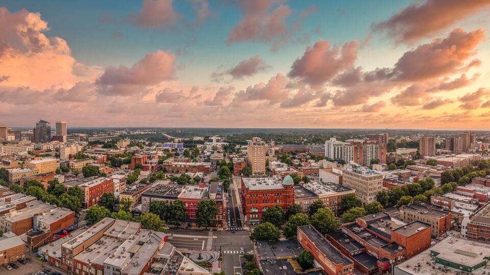 Aerial sunset view of Richmond capital city of Virginia with dramatic sky overlooking the fan district and monroe ward, main street