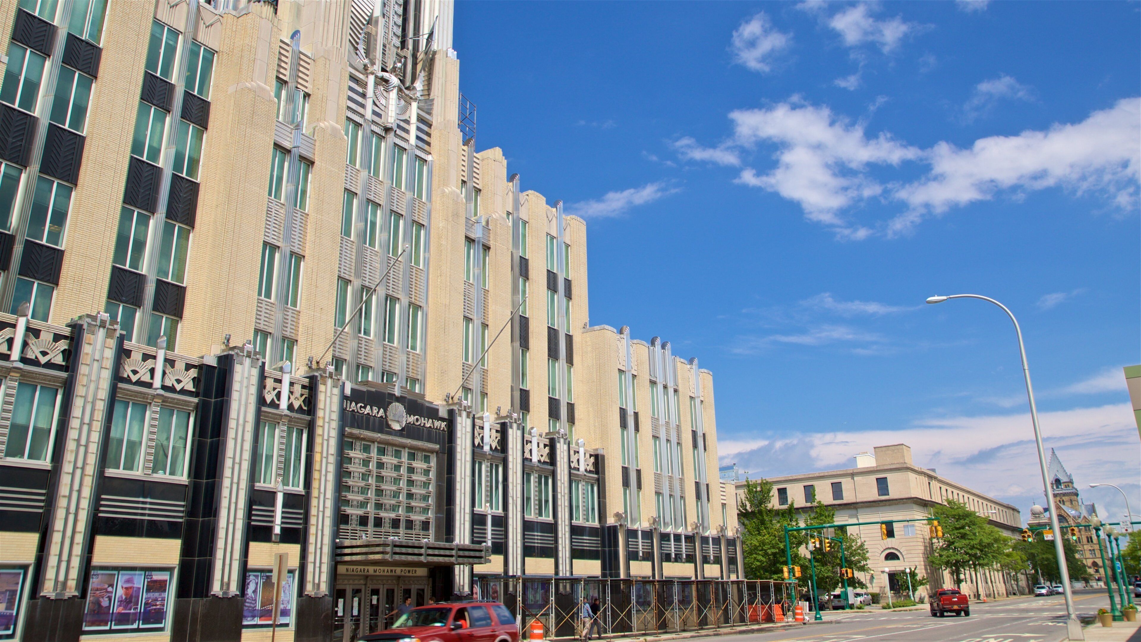 A large, ornate building with a classic design, featuring multiple windows and decorative elements.