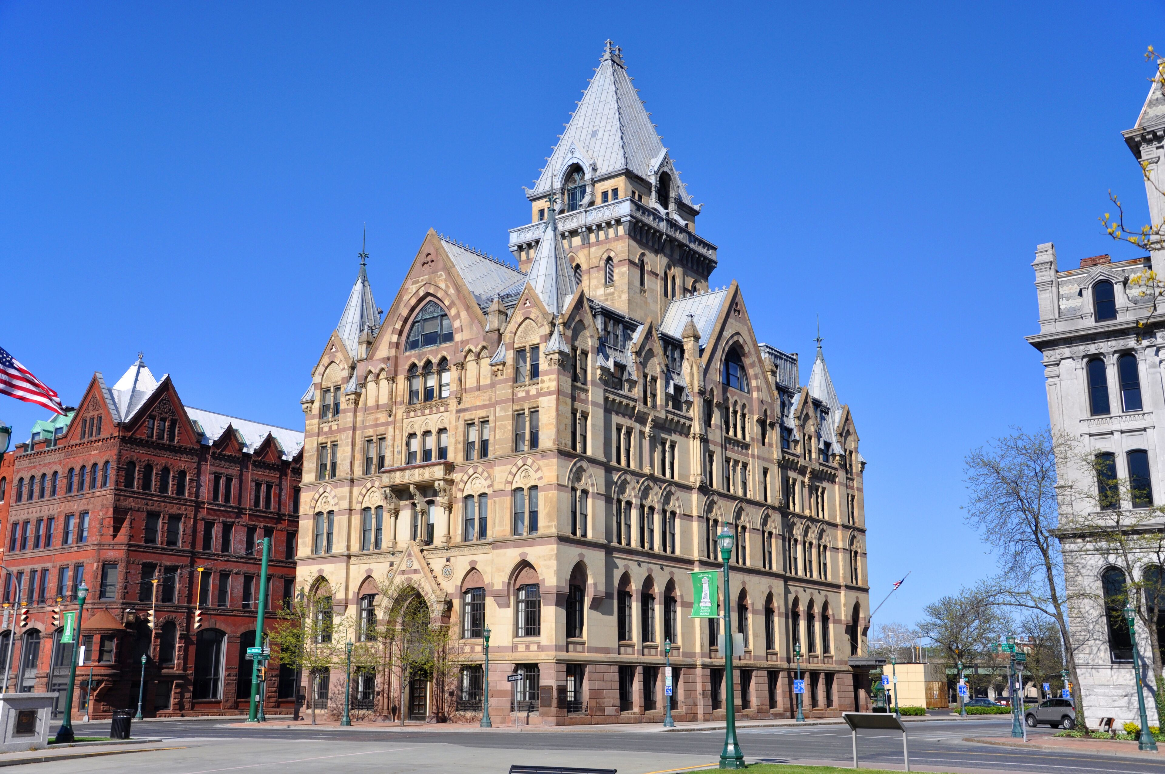 A historic building with a pointed roof and arched windows.