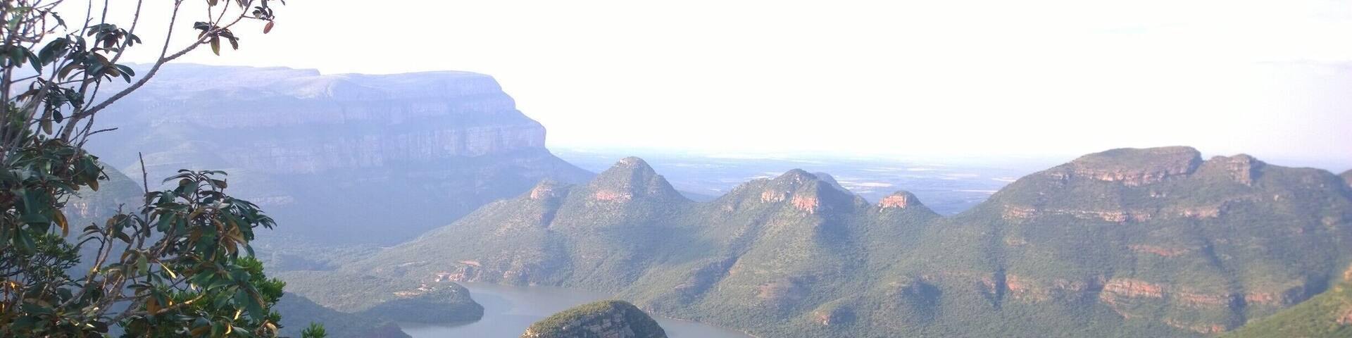 A mountainous landscape with a river winding through it.