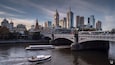 A river with a bridge and a boat.