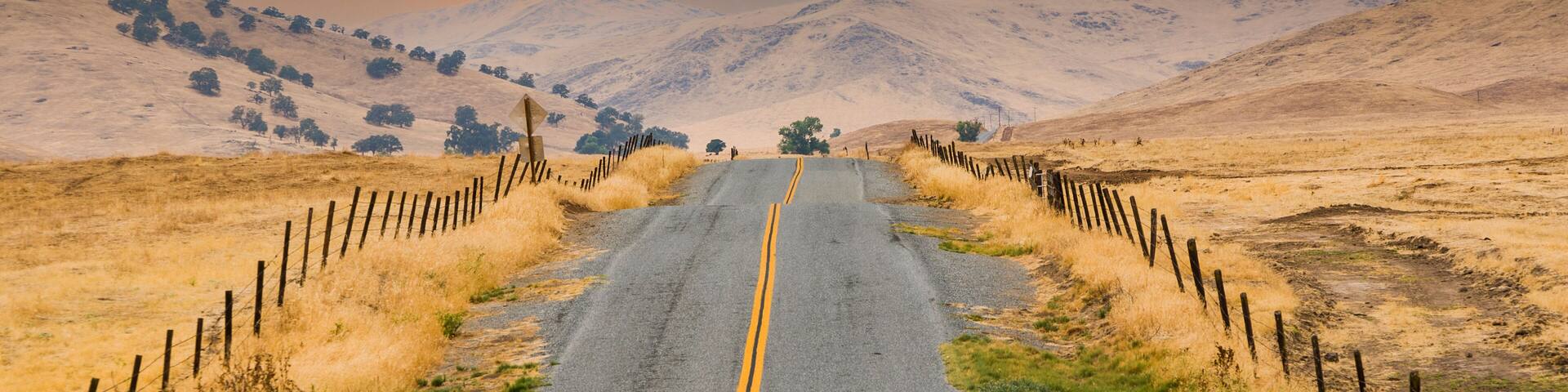 street near exeter in the contryside with nice meadows, green grass and lovely hills
