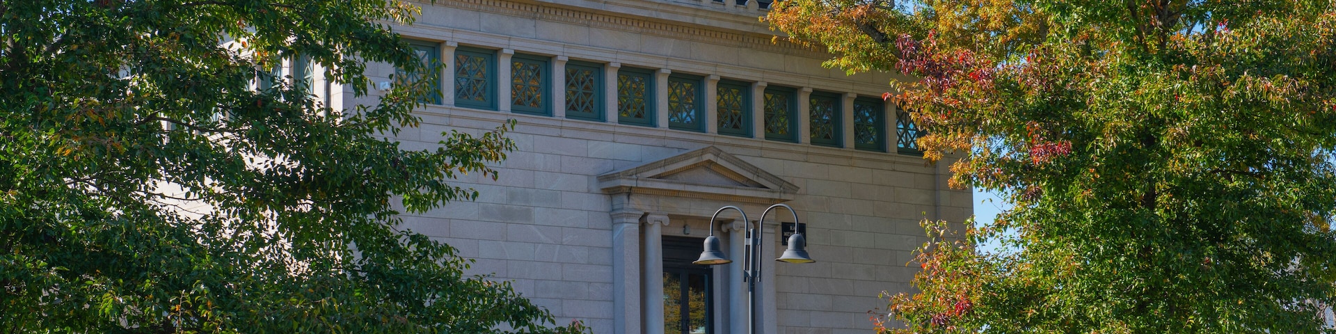 Franklin Public Library in fall at 118 Main Street in historic town center of Franklin, Massachusetts MA, USA. This library is the first and oldest public library in the US.