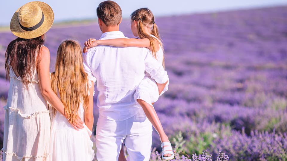 A family of four in a lavender field.
