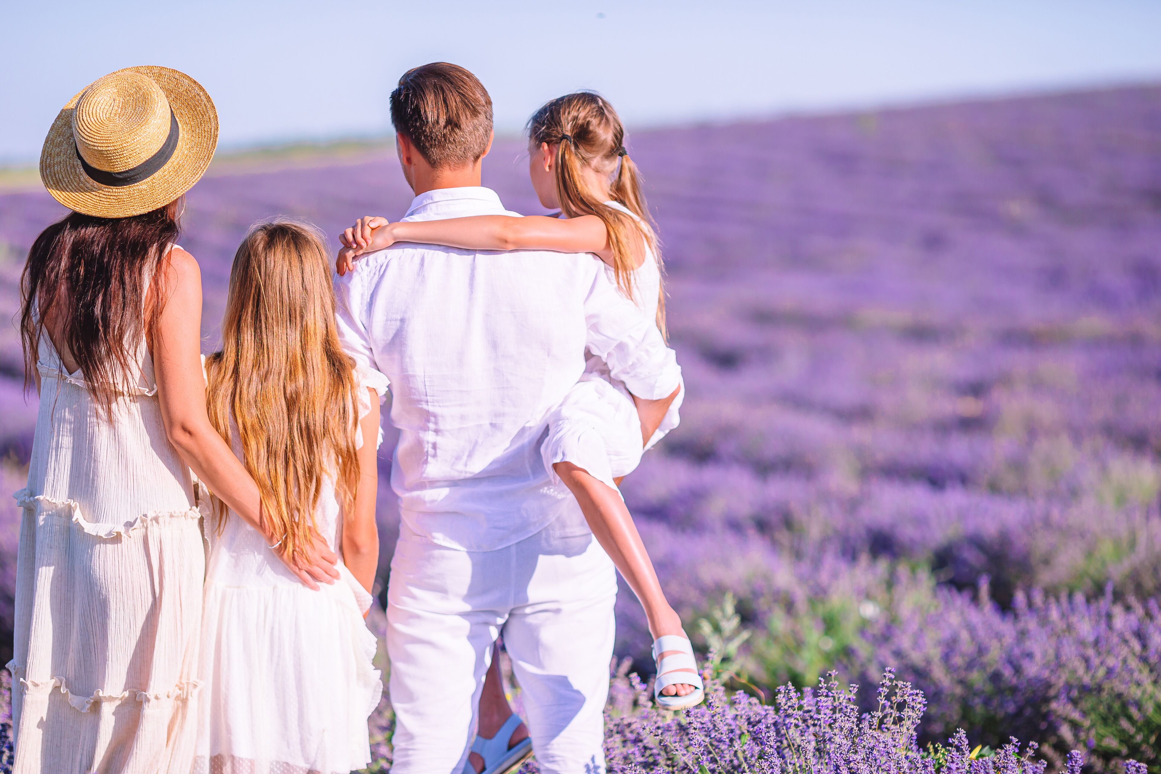 A family of four in a lavender field.