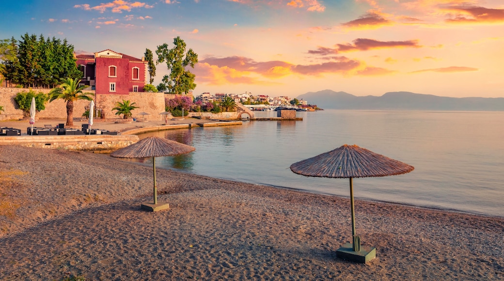 Calm summer scene of Chalcis town, Greece. Colorful morning seascape of Aegean sea, North Euboean Gulf. Exciting sunrise in Euboea island, Greece, Europe. Traveling concept background..