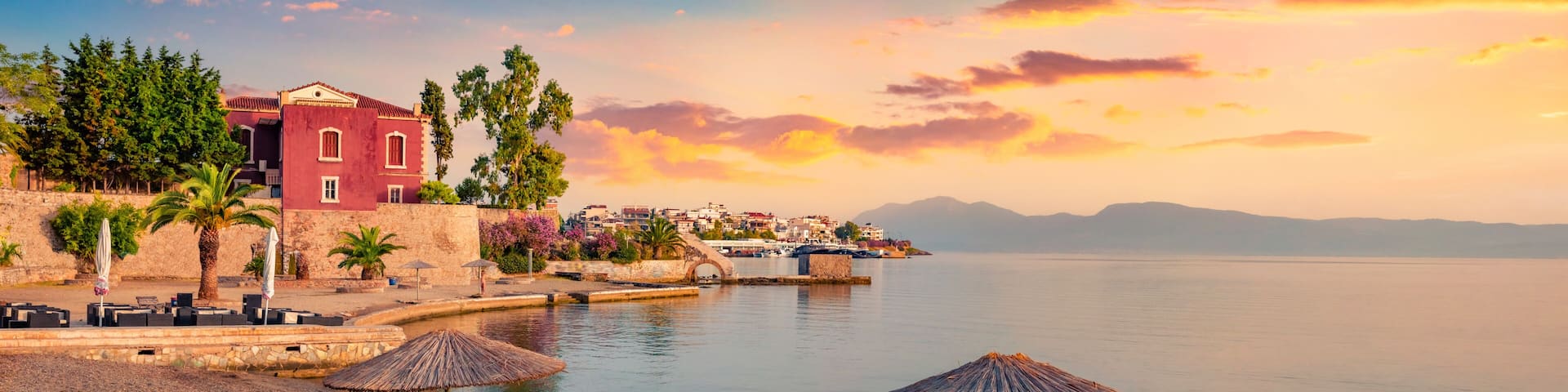 Calm summer scene of Chalcis town, Greece. Colorful morning seascape of Aegean sea, North Euboean Gulf. Exciting sunrise in Euboea island, Greece, Europe. Traveling concept background..