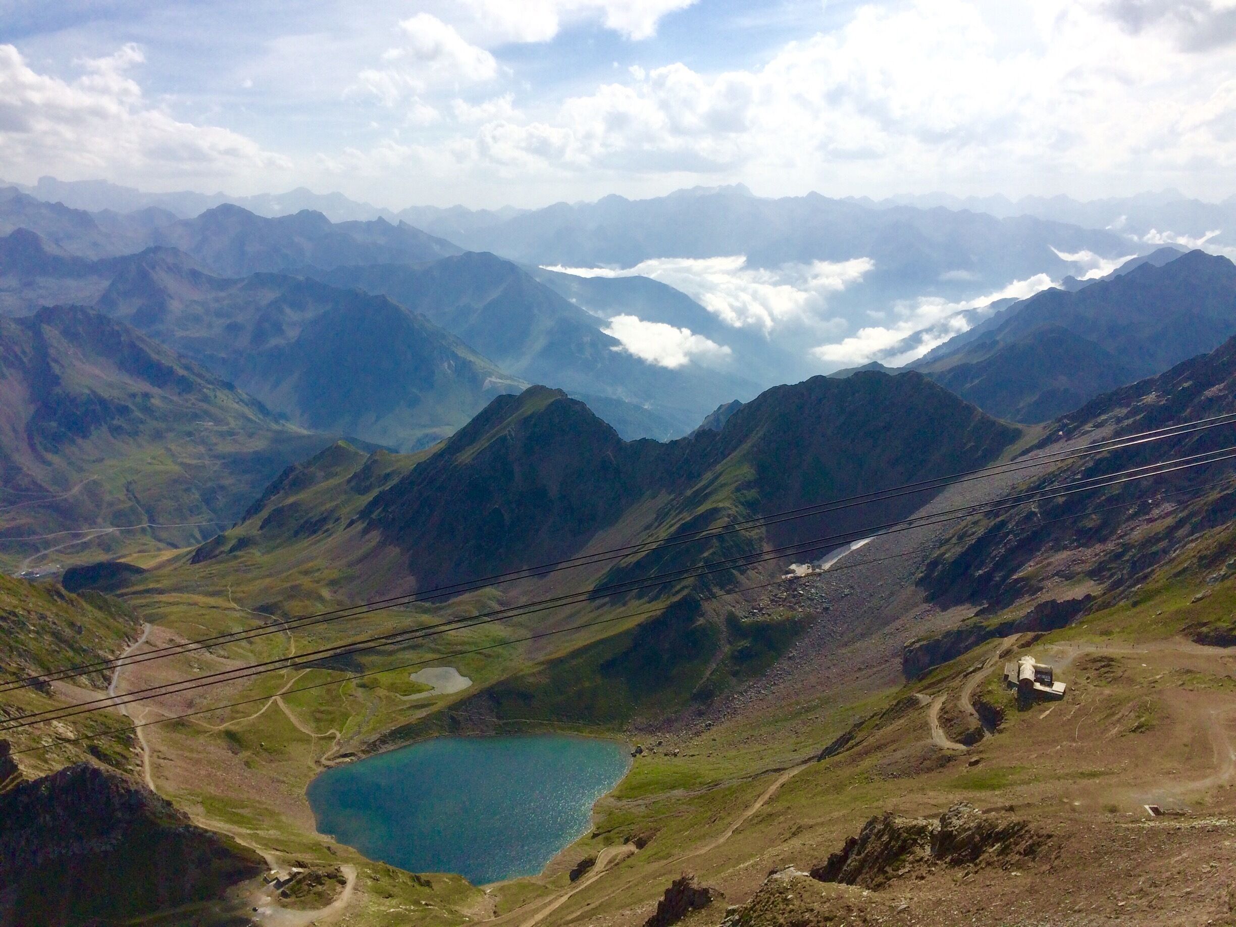 Drove up through cloudy valley to bright sunshine at the col and clouds were way below us when we reached the summit. 