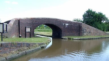 The Ashby Canal at Marston Junction, Warwickshire. The Ashby Canal Company was formed in 1792 with intention of connecting the Coventry Canal at Marston Jabbett with limeworks and new coalfields near Ashby-de-la-Zouch. The canal, when it was built, did not go further than Moira, a distance of 30 miles with no locks, following the 300 foot contour line. The hilly section beyond this was not constructed, an extensive system of tramroads being preferred. At present, the canal ends at Snarestone (22 miles), the last eight miles being abandoned because of mining subsidence. However, the latest Nicholson canal guide anticipates completion of extensive restoration activity by detailing the route as far as Conkers, past Moira. Here is Dr Clifton's photograph from 1976. 462867