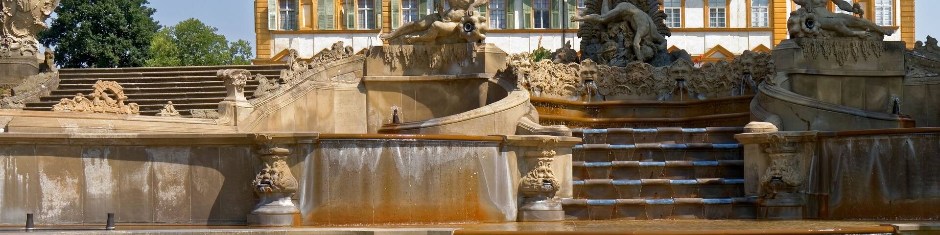 Memmelsdorf, Germany - historic fountain on the background of the palace.