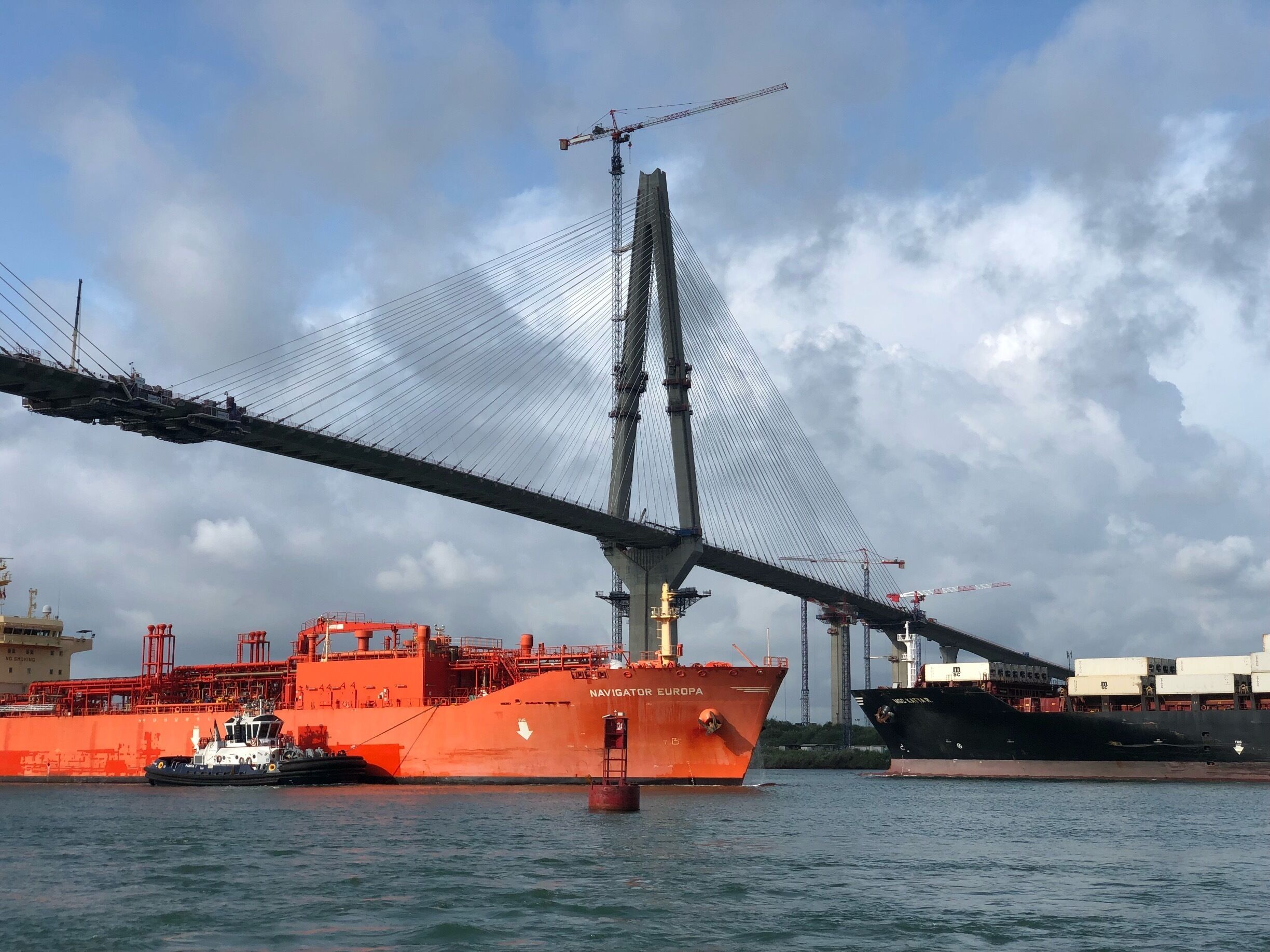 Two big vessels crossing the future bridge near the Caribbean Sea