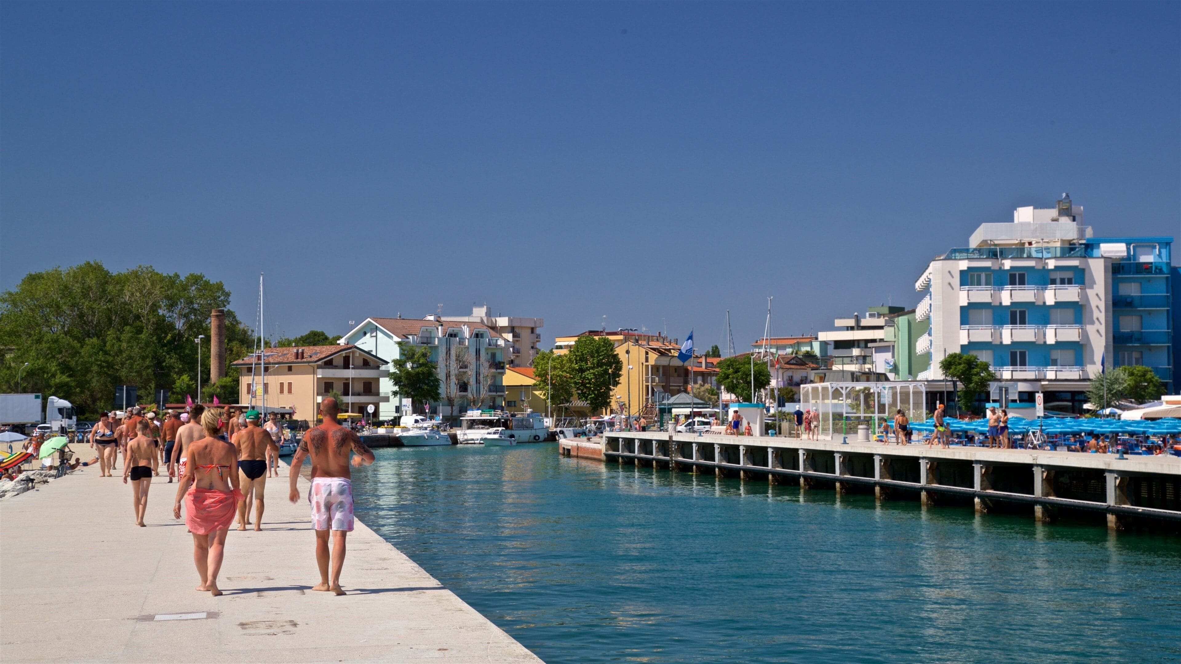 Bellaria-Igea Marina showing a river or creek as well as a couple