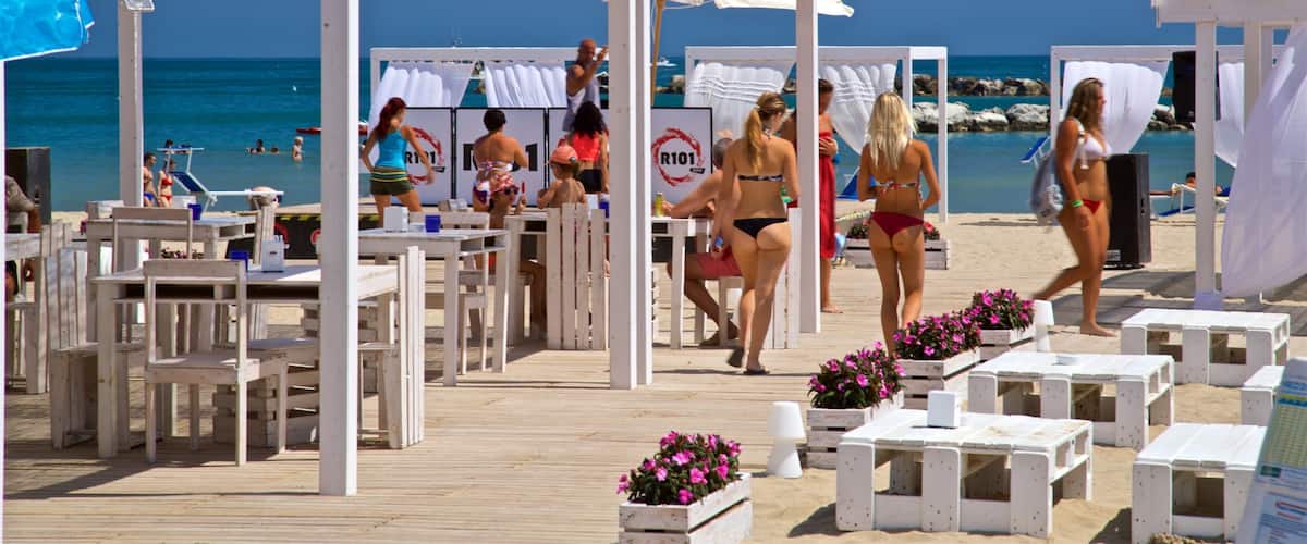 Bellaria-Igea Marina showing general coastal views as well as a small group of people