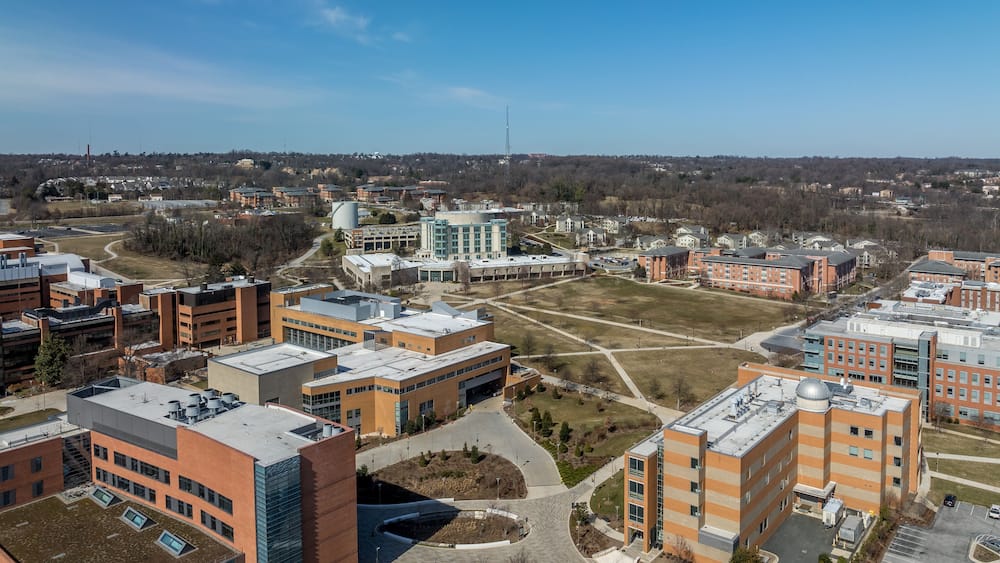 Aerial view of University of Maryland Baltimore County UMBC Catonsville admission office, pool, commons, quad, Honors college, admission office, retriever activities center, kuhn plaza, erickson field