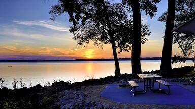 Travel trailer camping by the Mississippi river at sunset in Thomson Causway Illinois