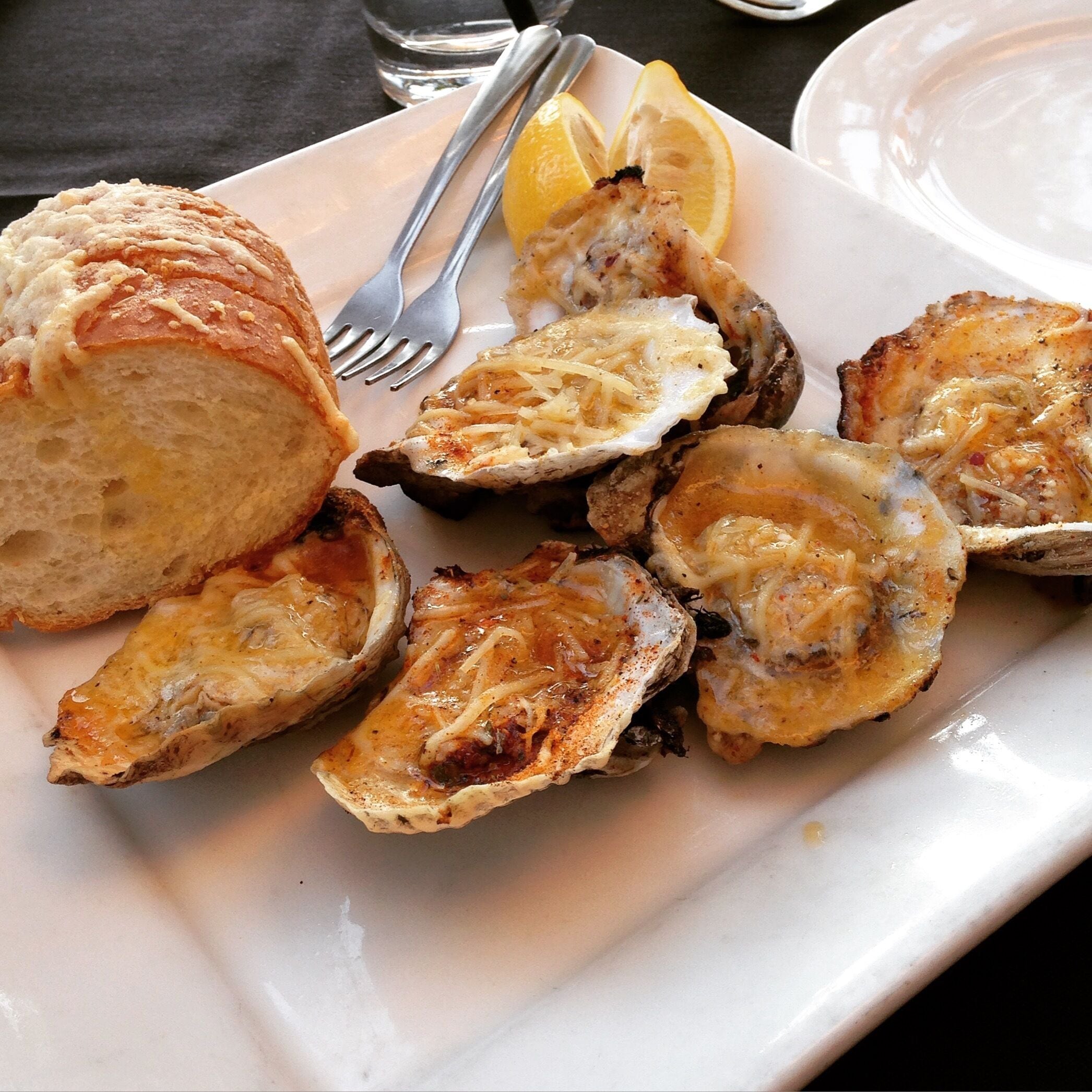 Oysters from Nola Grill. I'm not usually big on oysters, but put enough melted butter and cheese on anything, and I'm on board. #lifeatexpedia #foodie