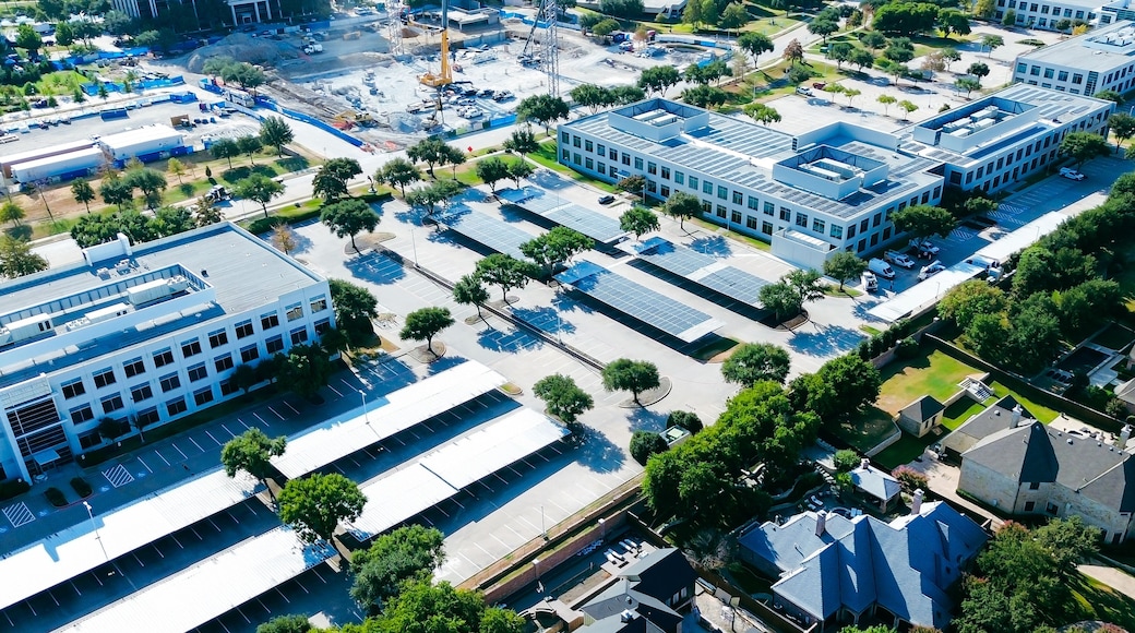 Network Boulevard links multi-building corporate offices with expansive shaded parking rows. Commercial tech centers interface with tranquil luxury neighborhood borders, Frisco, Texas