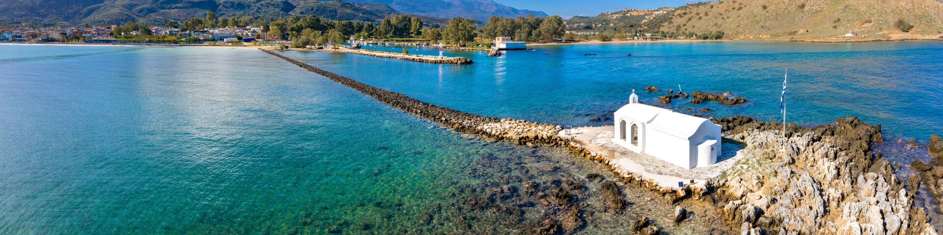 Small white church Saint Nikolaos in the sea, Georgioupoli, Crete, Greece.