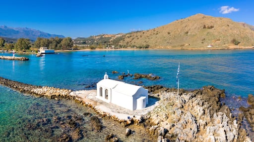 Small white church Saint Nikolaos in the sea, Georgioupoli, Crete, Greece.