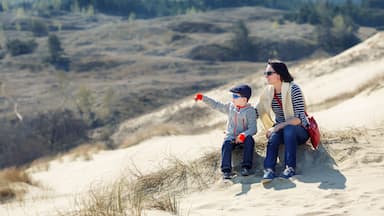 Mother and son together on sand Dunes in Neringa