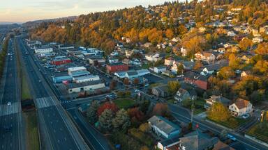 Aerial view of a small town with beautiful autumn foliage and a freeway, Kalama, Washington, United States.