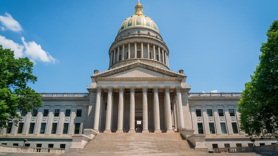 A large neoclassical building with a prominent dome and columns.