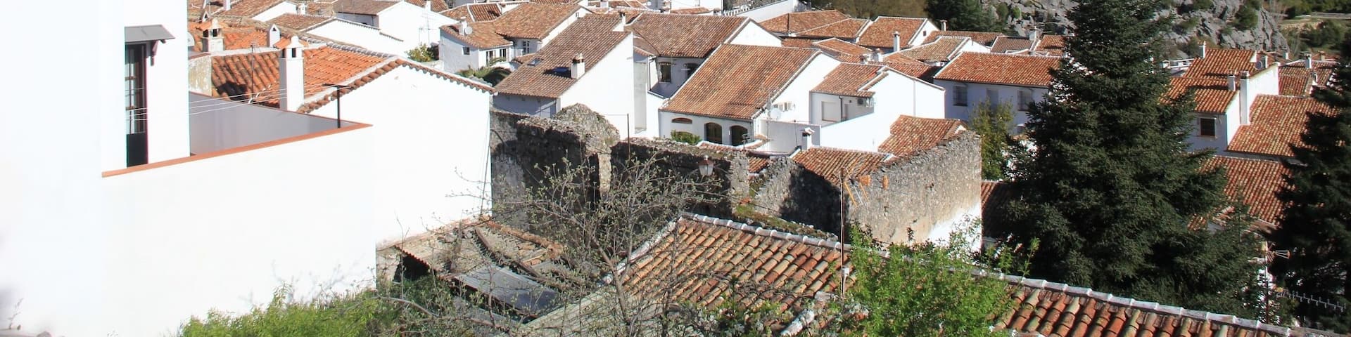 Of all the pueblos blancos (white towns) we visited on our road trip through Andalucia, Grazalema was one of the prettiest.
Nestled on the steep rocky slopes of the mountains within the Sierra de Grazalema national park, Grazalema is surrounded by stunning vistas and a fantastic choice of hiking routes through them.
There's also an artisan textile factory in the town that still employs traditional weaving methods.