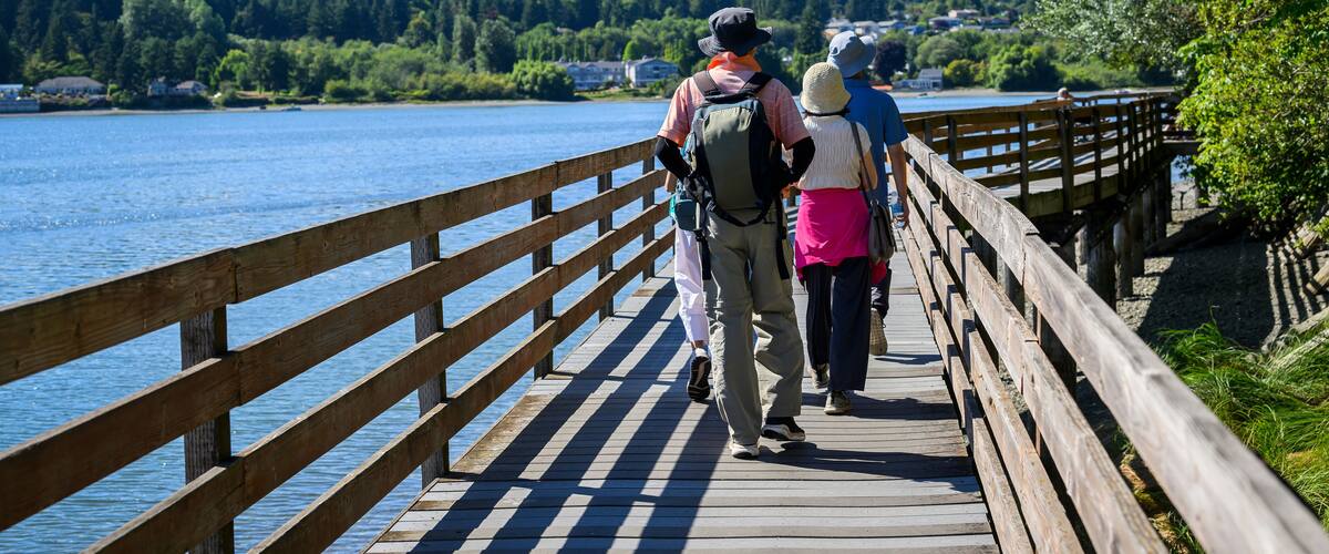 People walking on the bridge in Poulsbo. Poulsbo is a city on Liberty Bay in Kitsap County, Washington State.