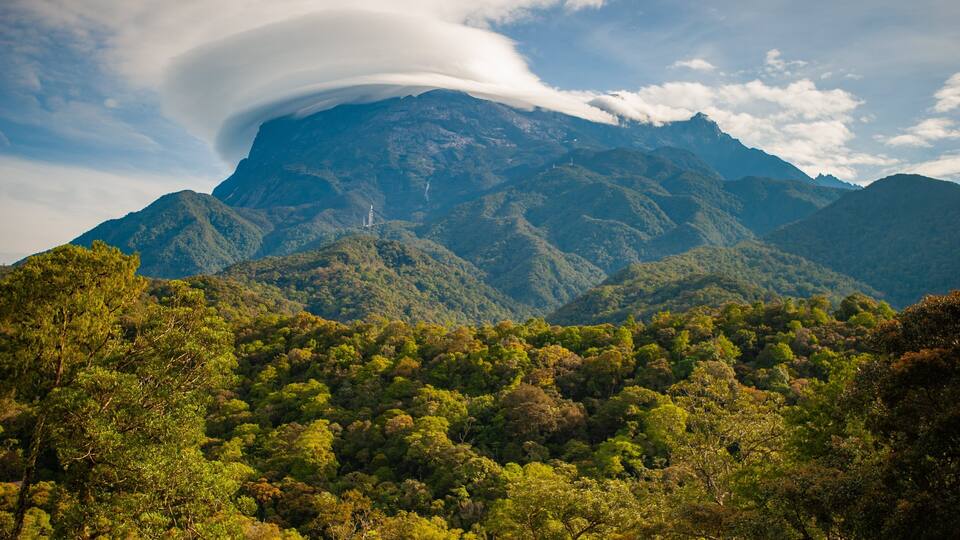 A mountain range with a prominent cloud formation.