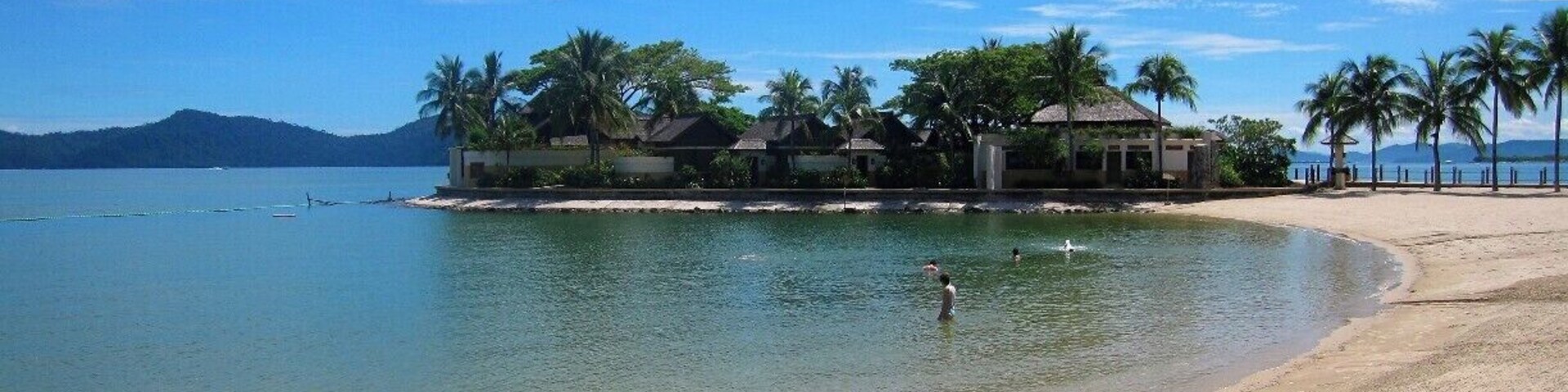 The waves are slowly crashing onto the beach, a family of four are swimming in the sea, and the hotel staff are rushing to get ready for breakfast. As I sat down on the beach, I thought to myself, 'Why did I get out of bed so early?' I decided to take this photo and at that moment, I realised why.