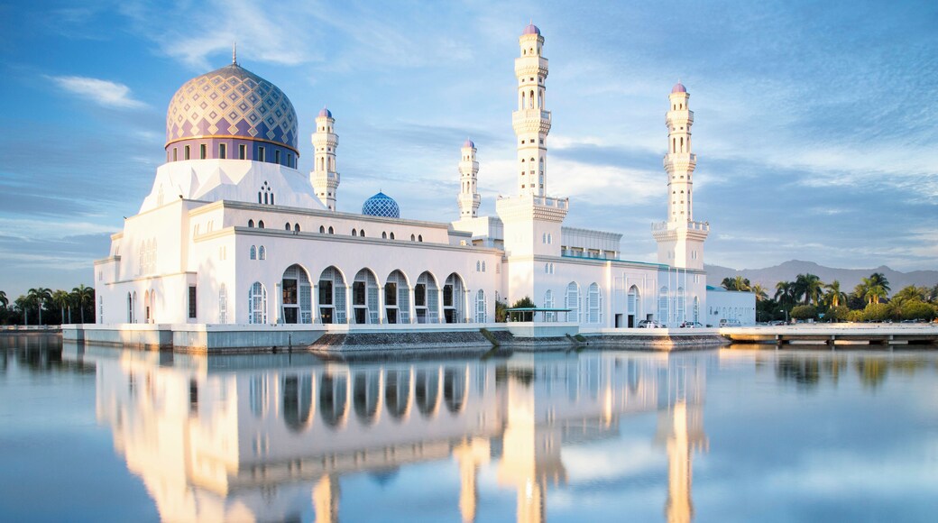 Mosque, Masjid Bandaraya a place of solace in hectic Kota Kinabalu in Borneo. Late afternoon as the sun lit up the building. Shot from the wall outside.