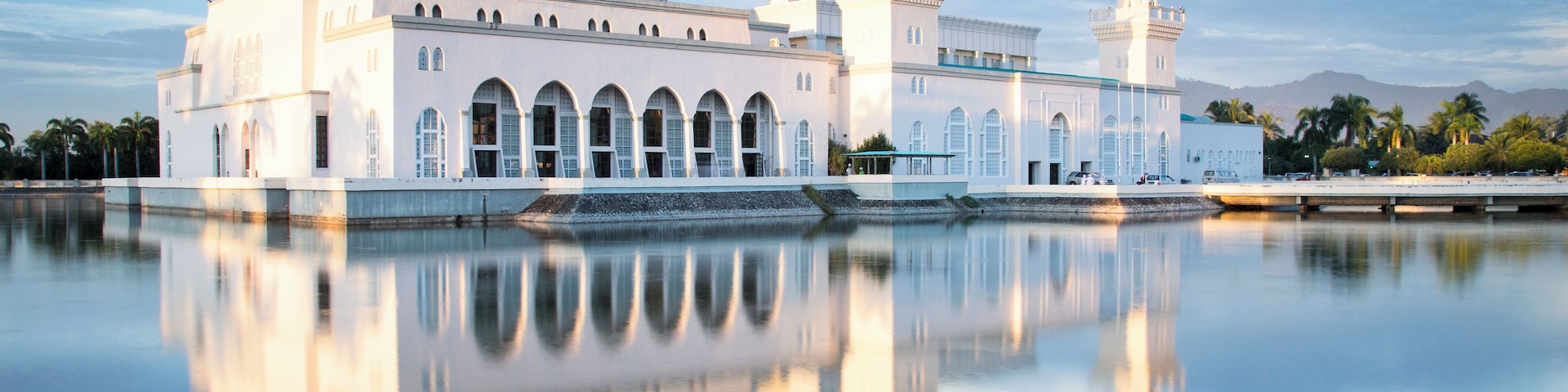 Mosque, Masjid Bandaraya a place of solace in hectic Kota Kinabalu in Borneo. Late afternoon as the sun lit up the building. Shot from the wall outside.