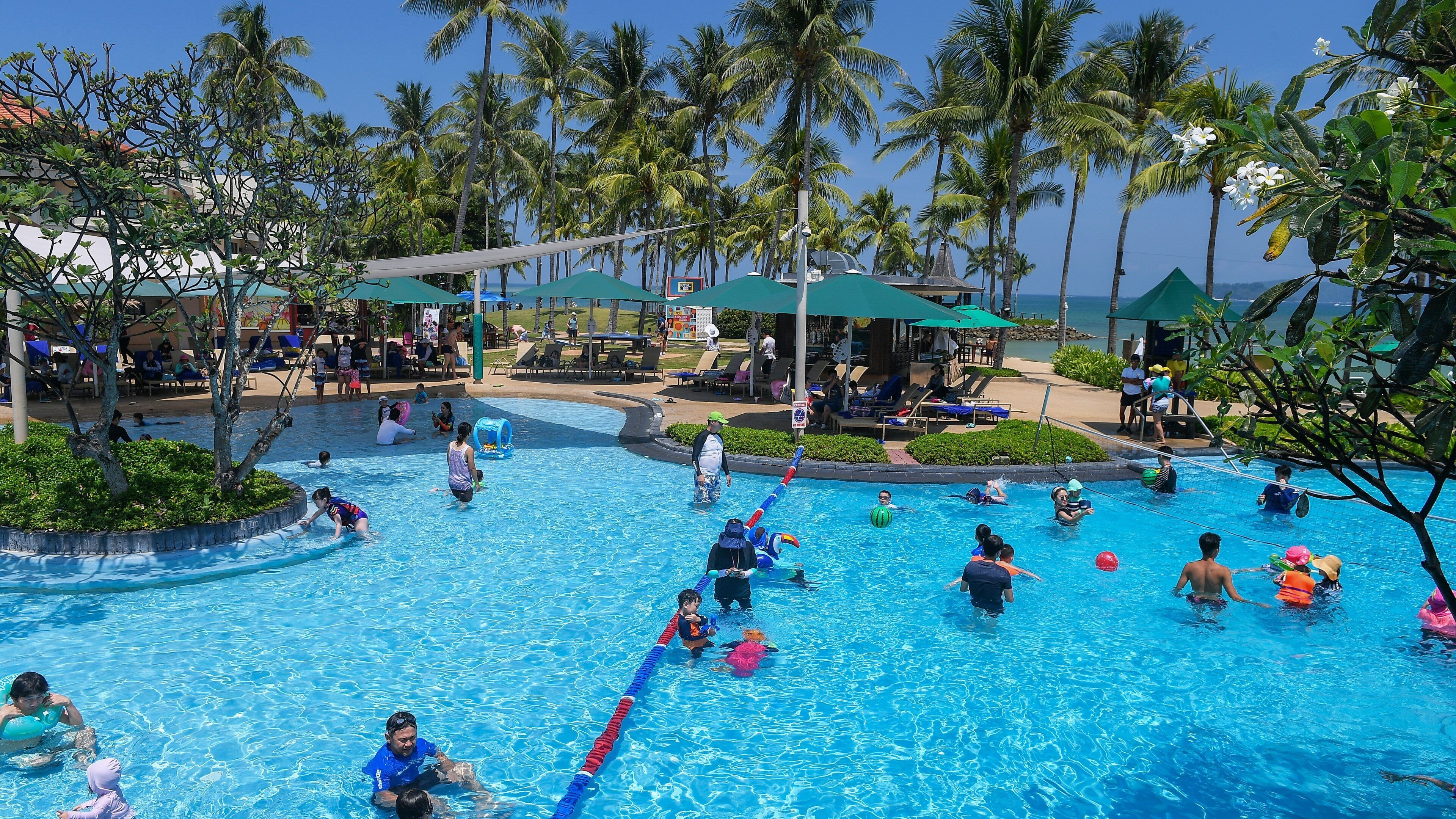 Kota Kinabalu which includes a pool and swimming